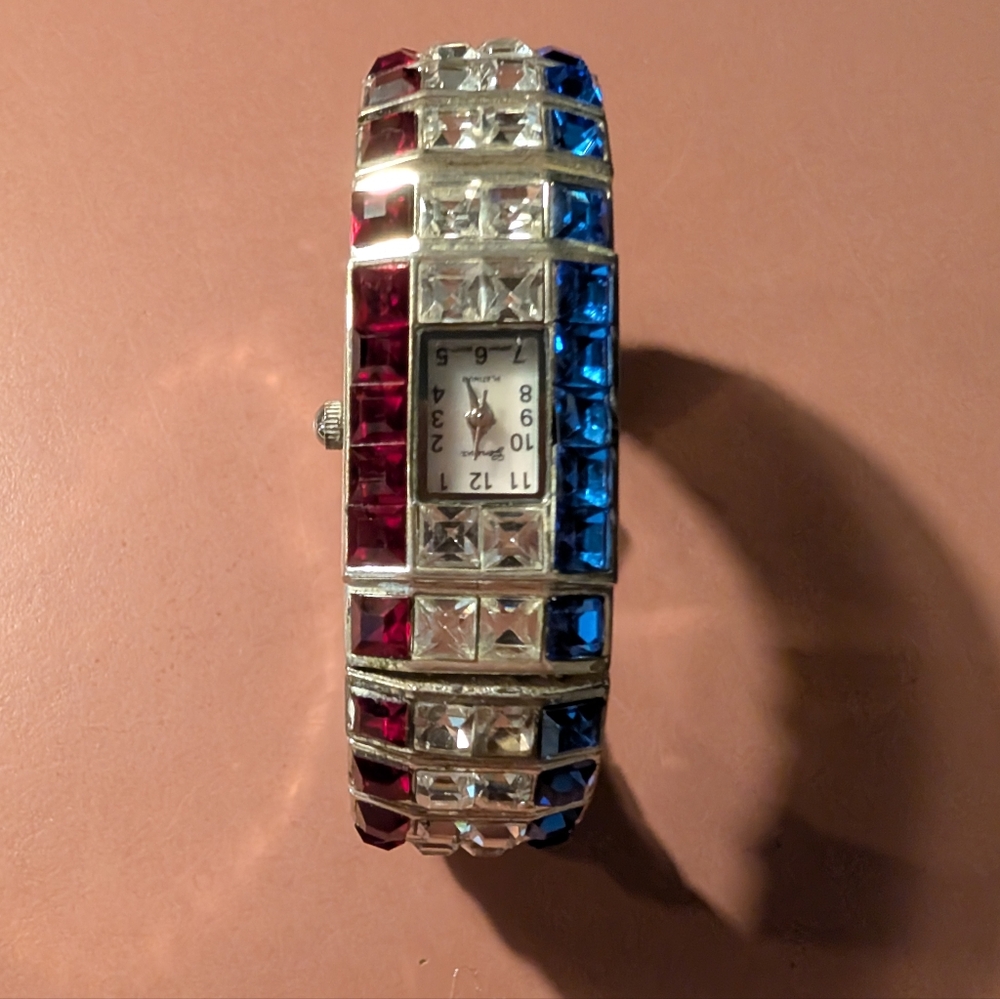 Elegant Silver Watch with Red, White And Blue Accents